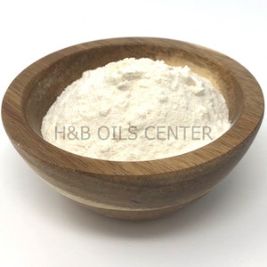 May include: A white powder in a wooden bowl. The bowl is labeled "H&B Oils Center".