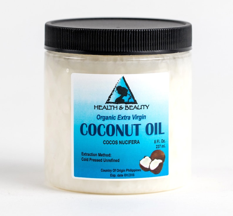 May include: A clear plastic jar with a black lid filled with white coconut oil. The label is blue and white and reads "HEALTH & BEAUTY Organic Extra Virgin COCONUT OIL COCOS NUCIFERA 8 Fl. Oz. 237 ml. Extraction Method: Cold Pressed Unrefined Country Of Origin Philippines Exp. date"