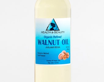 May include: A clear bottle of organic refined walnut oil, labeled "Health & Beauty." The label includes the text "WALNUT OIL" and "JUGLANS REGIA." The bottle contains 4 fl oz (118 ml) of oil. The extraction method is cold pressed.