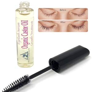 May include: A clear bottle with a pink label that reads "Eyelash Serum Organic Castor Oil Growth Treatment" and a black applicator brush. The bottle is next to a before and after image of a person's eyelashes.