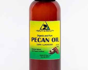 May include: A 2-ounce bottle of organic and pure pecan oil. The bottle is brown glass with a black cap. The label is green and yellow with the words "Health & Beauty", "Organic and Pure", "Pecan Oil", "Carya Illinoinensis", "Extraction Method: Cold Pressed Unrefined", "2 Fl. Oz. 59 ml", "Country of Origin USA".