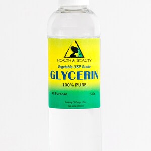 May include: A clear glass bottle with a white cap, containing a liquid. The label is yellow and green with the text "HEALTH & BEAUTY Vegetable USP Grade GLYCERIN 100% PURE All Purpose 5 Oz. Country Of Origin USA Exp. date"