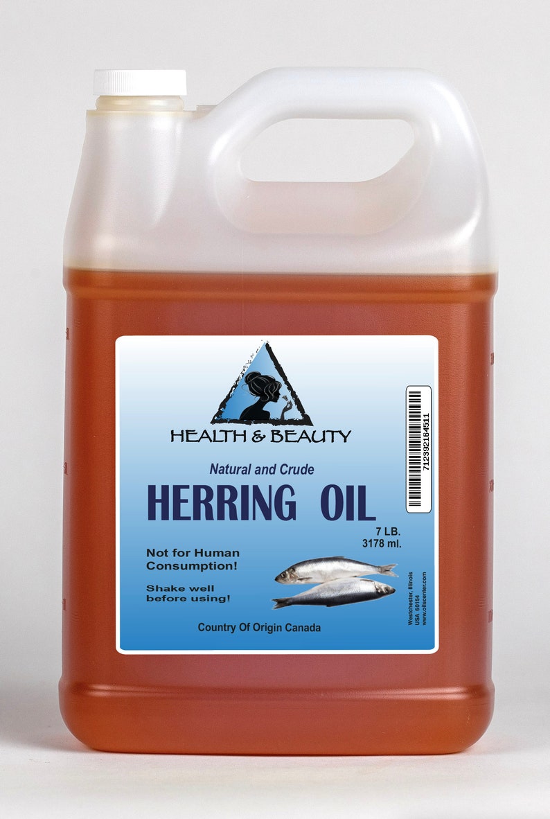 May include: A gallon jug of amber-colored herring oil with a white label. The label reads "Health & Beauty Natural and Crude Herring Oil 7 LB. 3178 ml. Not for Human Consumption! Shake well before using! Country of Origin Canada".