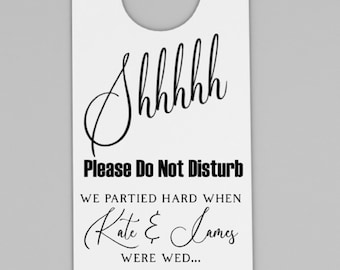 May include: White door hanger with a hole at the top for hanging. The text on the hanger reads "Shhhhh Please Do Not Disturb. We partied hard when Kate & James were wed... So we need to stay in bed. Smith Wedding Guests."