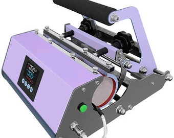 May include: A purple and gray mug press with a digital display showing "000.0" and a green button. The press has a handle with a black foam grip and a metal frame.