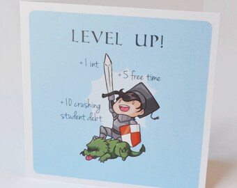 May include: A blue card with the text "LEVEL UP!" and a cartoon illustration of a graduate wearing a cap and gown, holding a sword and riding a green dragon. The card also includes the text "+1 int +5 free time +10 crushing student debt".