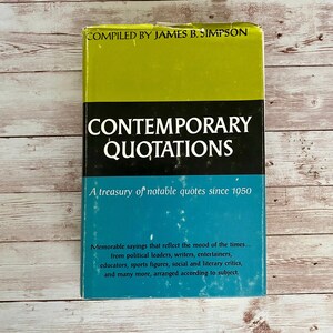 May include: A vintage hardcover book titled "Contemporary Quotations" with a green, black, and blue cover. The book, compiled by James B. Simpson, features notable quotes since 1950, arranged by subject.