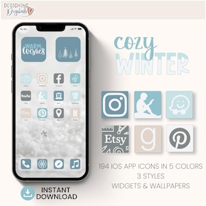 May include: A digital phone screen mockup with a winter themed app icon set. The icons are in a variety of colors, including blue, gray, and white. The text on the screen says "Warm Wishes" and "Cozy Winter". The text at the bottom of the image says "194 IOS APP ICONS IN 5 COLORS 3 STYLES WIDGETS & WALLPAPERS".