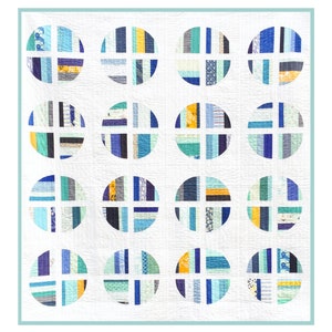May include: A white quilt featuring 16 blue, green, and yellow circles. Each circle has a white cross inside and is constructed from various coloured fabric strips.