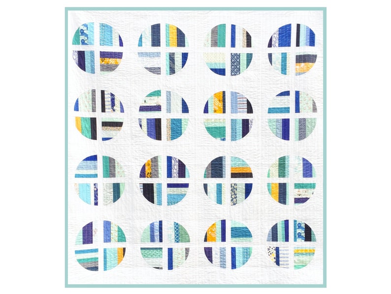 May include: A white quilt featuring 16 blue, green, and yellow circles. Each circle has a white cross inside and is constructed from various coloured fabric strips.