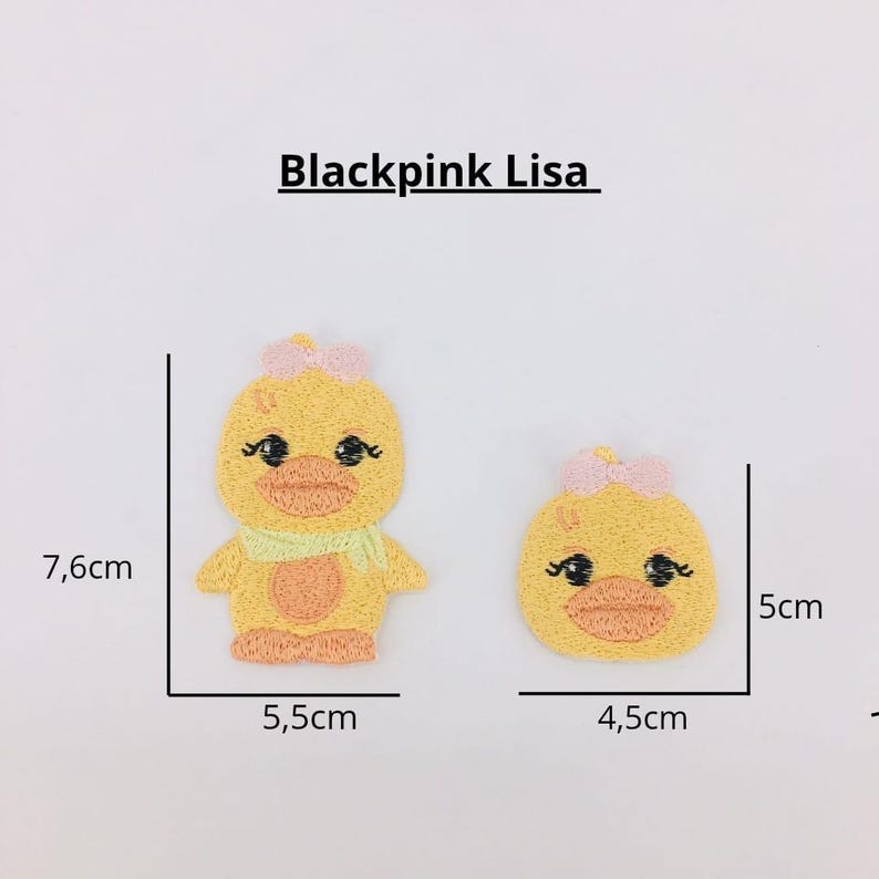 May include: Two yellow embroidered iron-on patches of a cartoon duck with a pink bow. The larger patch is 5.5 inches wide and 7.6 inches tall. The smaller patch is 4.5 inches wide and 5 inches tall.  Blackpink Lisa is written above the patches.