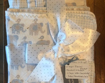 Crib sheet with satin insert, soft, two layered flannel receiving blanket, burp cloth, lovie.  Nursery ensemble