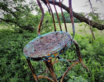 a chair worthy of hanging as art...French Country Metal Bistro Chair...wonderful, multi-colored chippy paint...Photo Prop Extraordinaire...
