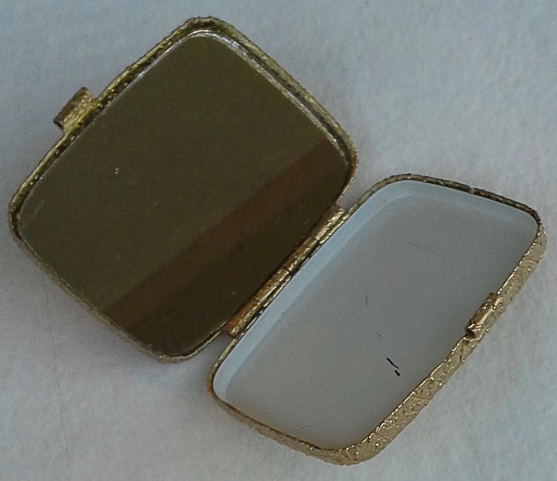 Vintage gold tone compact with mirror from Revlon