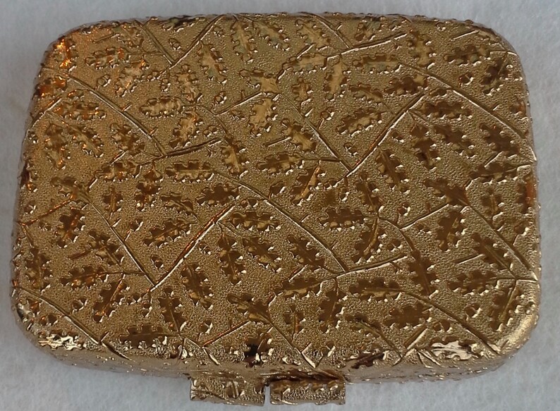 Vintage gold tone compact with mirror from Revlon