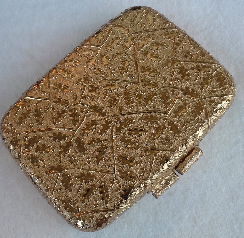 Vintage gold tone compact with mirror from Revlon