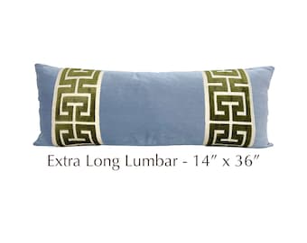 May include: A light blue lumbar pillow with a green and white geometric pattern on the ends. Extra Long Lumbar - 14" x 36"