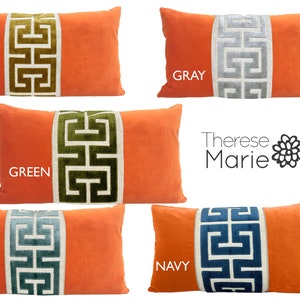 May include: Five orange velvet pillow covers with a white Greek key design in different colors: gold, gray, green, mist, and navy.  The pillow covers are all the same size and shape.