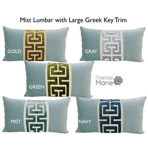 May include: Five lumbar pillows with a light blue background and a Greek key design in different colors. The colors are gold, gray, green, mist, and navy.