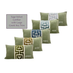 May include: Sage green velvet lumbar pillows with a large Greek key trim in various colors: gray, mist, navy, gold, and green.