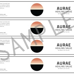 May include: Four labels for a healing salve product. Each label features a black and white circle with a peach and white gradient on top. The text on the label reads "AURAE HEALING SALVE" with the net weight listed as 2 oz / 59 ml. The ingredients are listed as organic coconut oil infused with plantain leaf, chamomile, calendula flowers, and lavender. Organic shea butter, candelilla seeds, and lavender essential oil. Made in Brooklyn with tropical vibes.