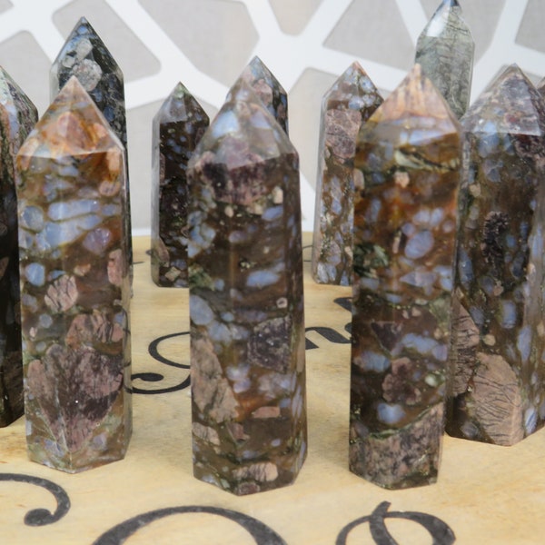 Que Sera Gemstone Towers, Blue Liberite Gemstone, Blue Quartz, Calcite, Kaolinite, Iron oxides, Magnetite, Clinozoisite, Leucozene