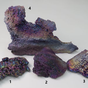 May include: Four iridescent, purple, and blue, rough, natural, mineral specimens. The specimens are labeled 1, 2, 3, and 4.