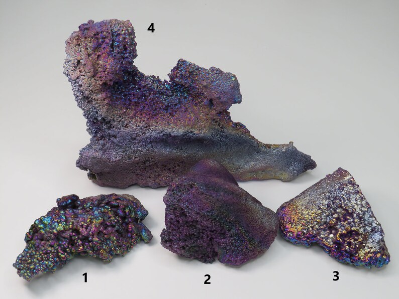 May include: Four iridescent, purple, and blue, rough, natural, mineral specimens. The specimens are labeled 1, 2, 3, and 4.