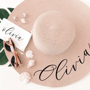 Blush pink sun hat with black vinyl text