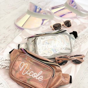 Rose gold and silver fanny pack on a patterned beach towel