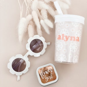 alyna cup with sunglasses and a flower girl candle