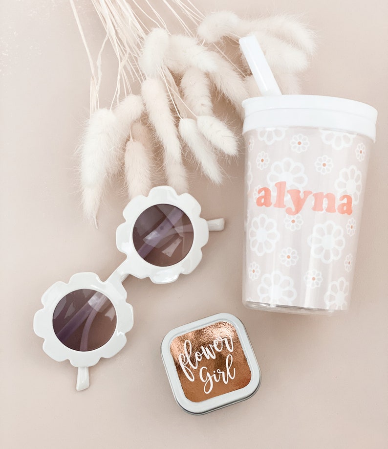 alyna cup with sunglasses and a flower girl candle