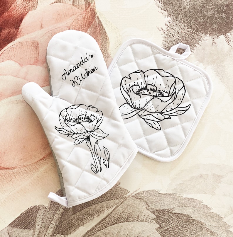 Personalized Oven Mitt have a quilted silver heat resistant back and hanging loop, print flower image and your chosen message