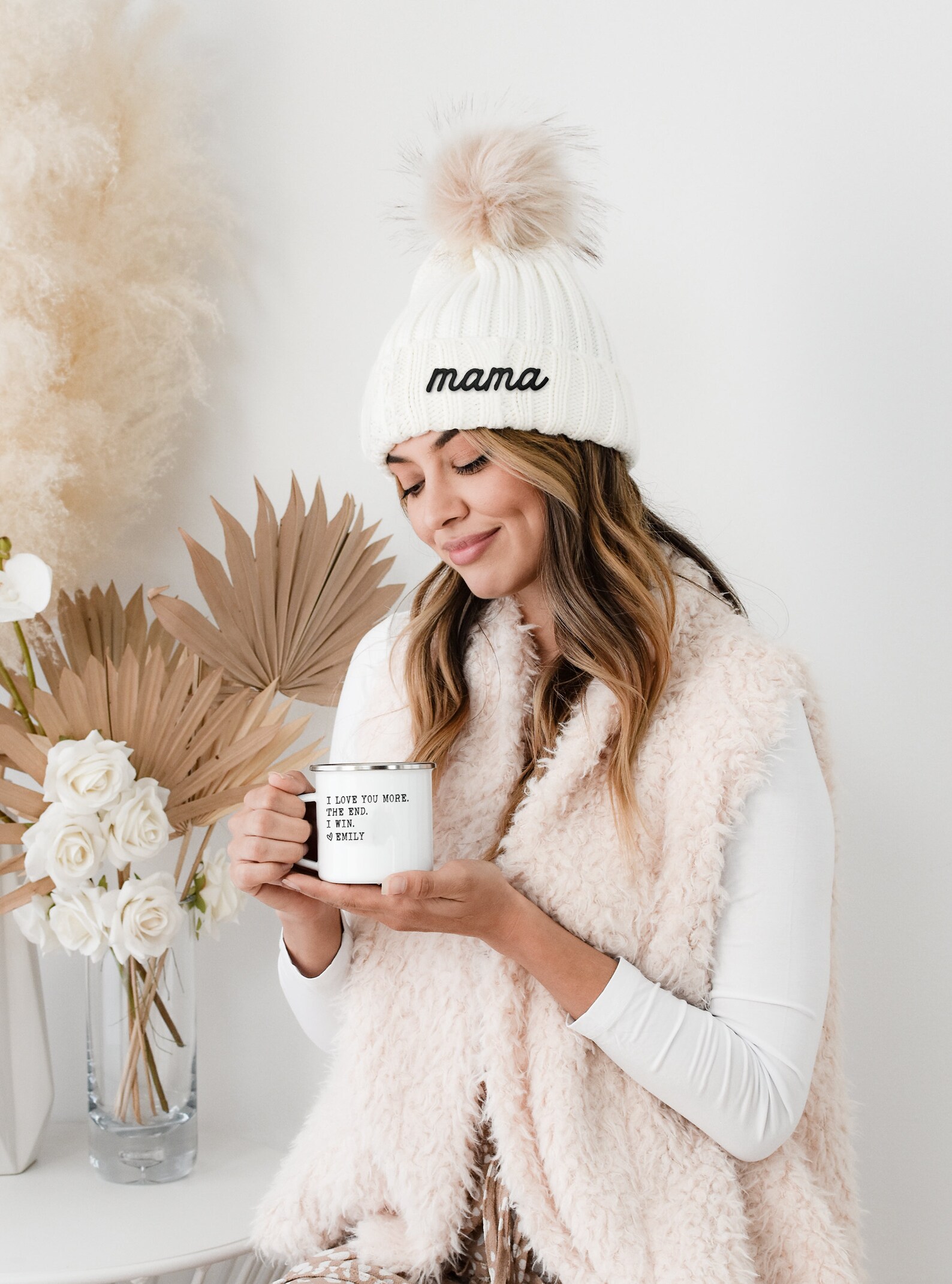 The faux fur hat in a delicate cream color will keep her heart warm all winter.