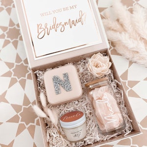 Bridesmaid proposal box filled with coffee glass and other small gifts.