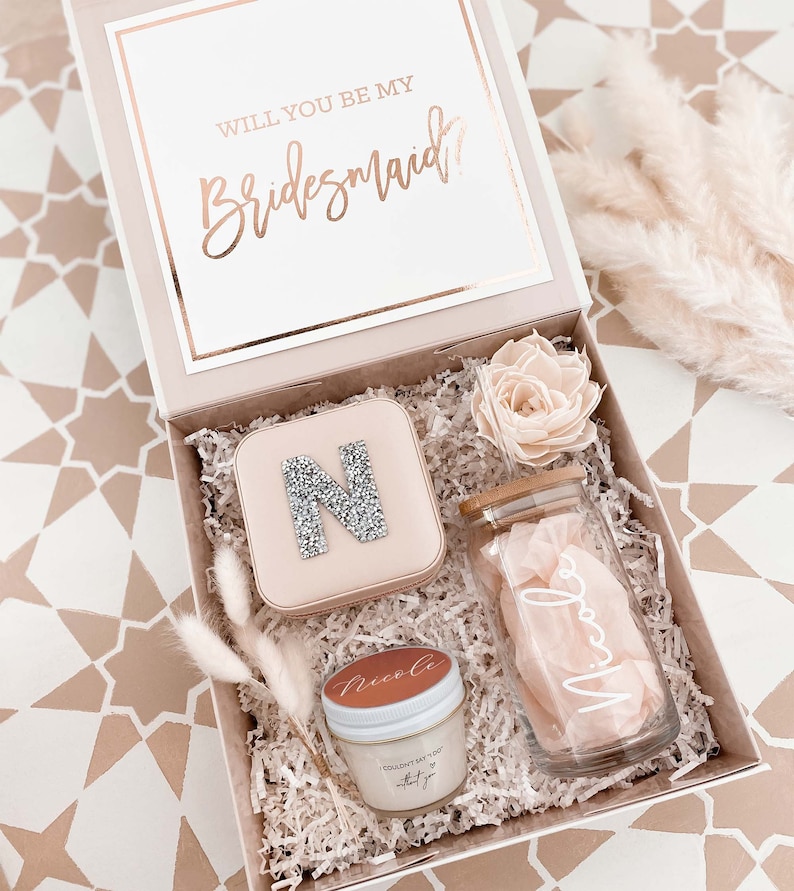 Bridesmaid proposal box filled with coffee glass and other small gifts.