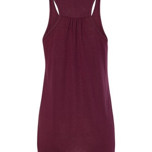 May include: A burgundy sleeveless tank top with a scoop neck.