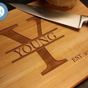May include: A wooden cutting board with the letter "Y" engraved in the center. The word "YOUNG" is engraved above the letter and "EST. 2014" is engraved below the letter.
