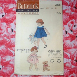 May include: Vintage sewing pattern for a girl's dress. The pattern is for a blue dress with pockets and a pink dress with pockets. The pattern is from Butterick and is size 2, 21 inch breast. The pattern number is 7295 and costs 35 cents.