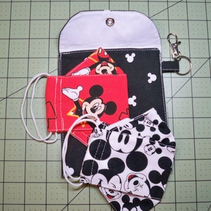 Mickey Mouse Masks and storage pouch with keyring and clasp to attach to bag or backpack.