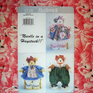 May include: A sewing pattern for making a teddy bear. The pattern is called "Needle in a Haystack!" and is from Butterick. The pattern includes three different designs for the bear, each with a different outfit. The pattern is for one size.