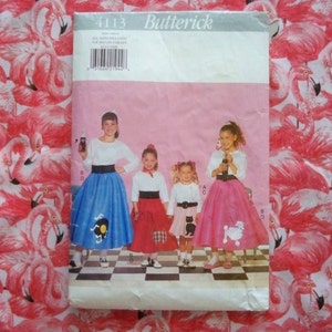 May include: A vintage sewing pattern for making 50s style skirts. The pattern is called Butterick 4113 and includes instructions for making three different skirts. The skirts are shown on four girls wearing white shirts and black belts. The skirts are blue, red, pink, and black. The pattern is on a pink background with a flamingo print.