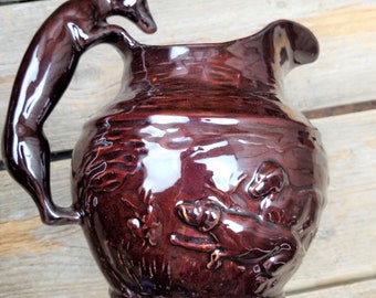 Antique Press Moulded Brown Glazed Earthenware Hound Handle Pottery Pitcher - Dogs Running in Meadow
