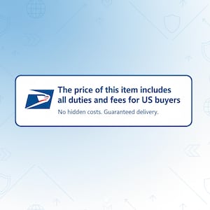 May include: A rectangular white sign with a dark blue border featuring the United States Postal Service logo on the left. The text reads: The price of this item includes all duties and fees for US buyers. No hidden costs. Guaranteed delivery.