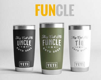 May include: Three stainless steel tumblers with black, green, and white exteriors. Each tumbler features a silver inscription that reads "They Call Me" followed by "Uncle", "Funcle", and "Tío" respectively. Each tumbler also has the text "ESTD 2022" and the Yeti logo.