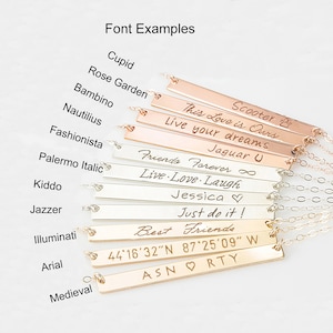 May include: A close-up of ten silver and gold bar necklaces with different engraved text, including "Scooter", "This Love is Ours", "Live your dreams", "Jaguar U", "Friends Forever", "Live Love Laugh", "Jessica", "Just do it!", "Best Friends", "44&deg;16&prime;32&Prime;N 87&deg;25&prime;09&Prime; W", and "ASNORTY".