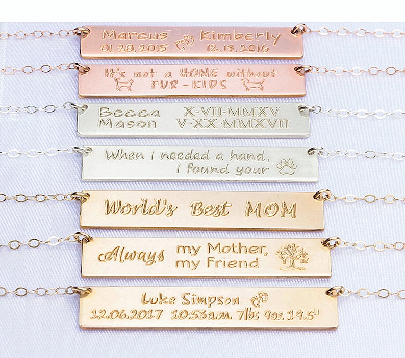 May include: Six gold, silver, and rose gold bar necklaces with personalized engravings. The engravings include names, dates, and messages like "It's not a home without fur-kids" and "World's Best Mom".