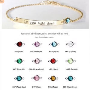 May include: A gold chain bracelet with a bar charm engraved with the words "Let your light shine". The bracelet has a small blue gemstone charm attached to it. The image also shows a selection of birthstone charms for each month of the year.