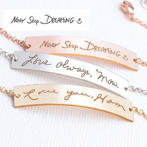 May include: Three metal bar bracelets with delicate chains. One rose gold bar is engraved with "Never Stop DREAMING :)", one silver bar with "Love always, Mom", and one gold bar with "Love you, Mom". Each piece features a polished finish.