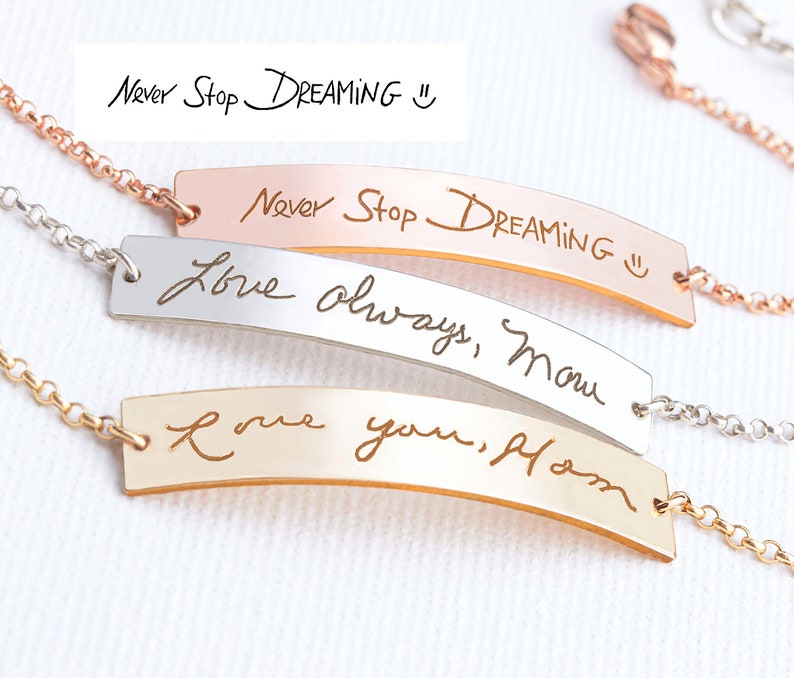 May include: Three metal bar bracelets with delicate chains. One rose gold bar is engraved with "Never Stop DREAMING :)", one silver bar with "Love always, Mom", and one gold bar with "Love you, Mom". Each piece features a polished finish.